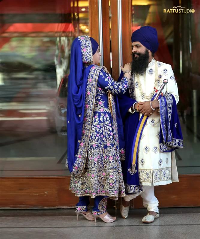 Blue wedding couple at doorway Rattu Studio Jalandhar