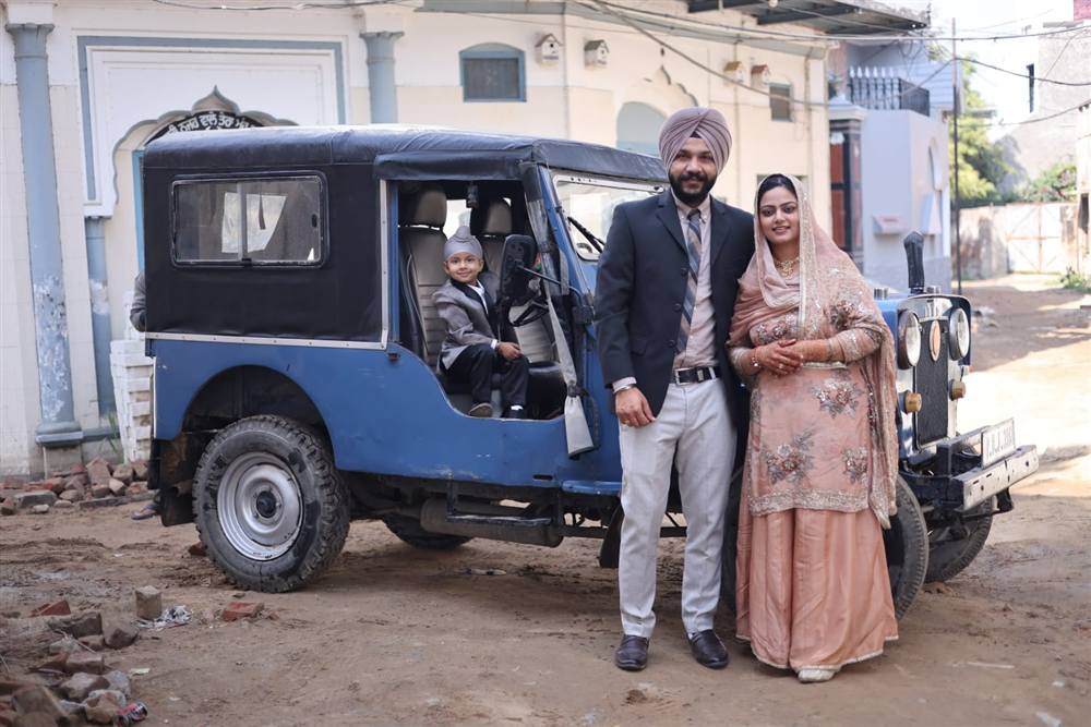 Family with vintage jeep Rattu Studio wedding Punjab