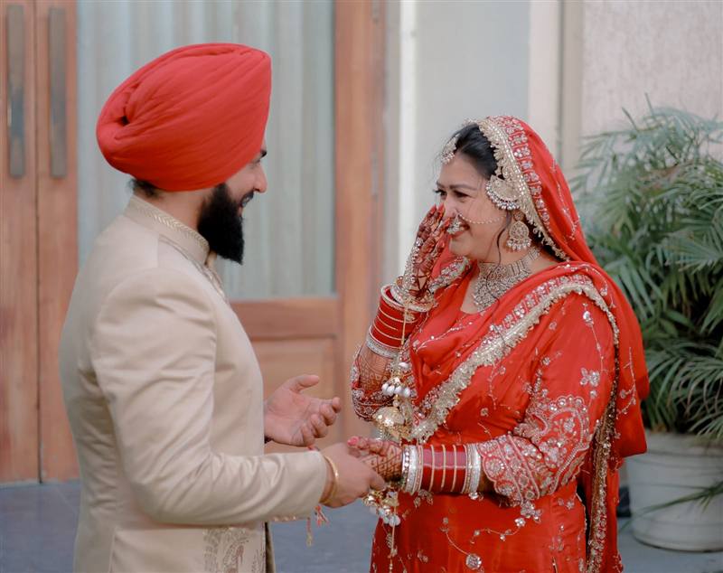 Bride laughing candid moment Rattu Studio wedding Jalandhar
